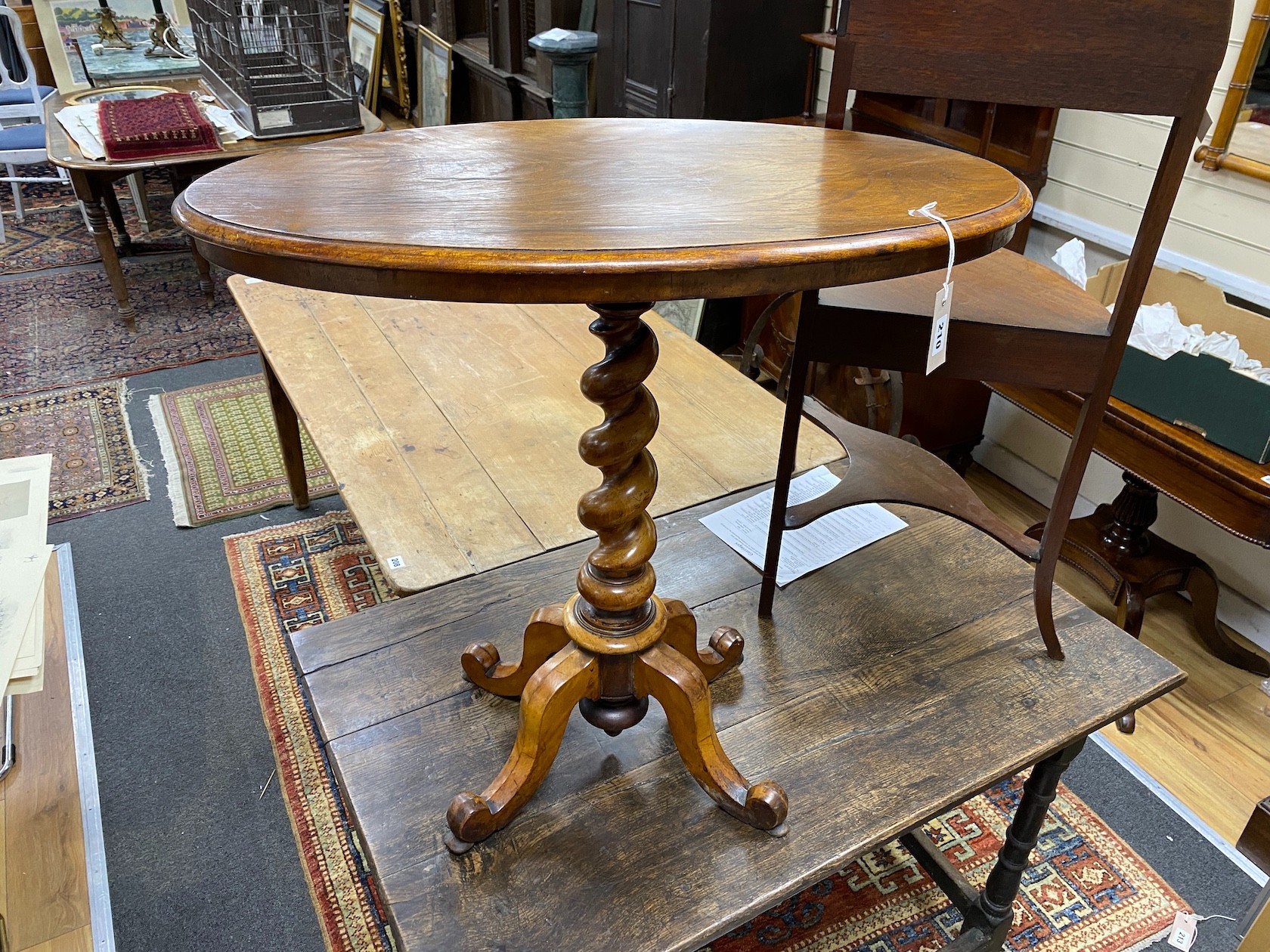 A Victorian Edwards & Roberts oval walnut occasional table on twist stem, width 76cm, depth 44cm, height 74cm